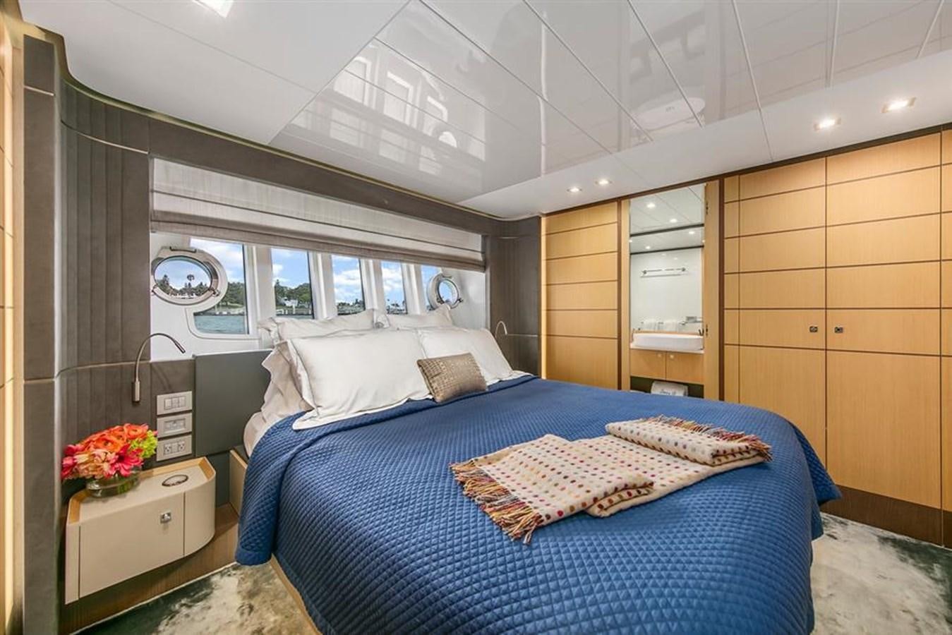 a bedroom with a bed aboard LONTANO Yacht for Sale