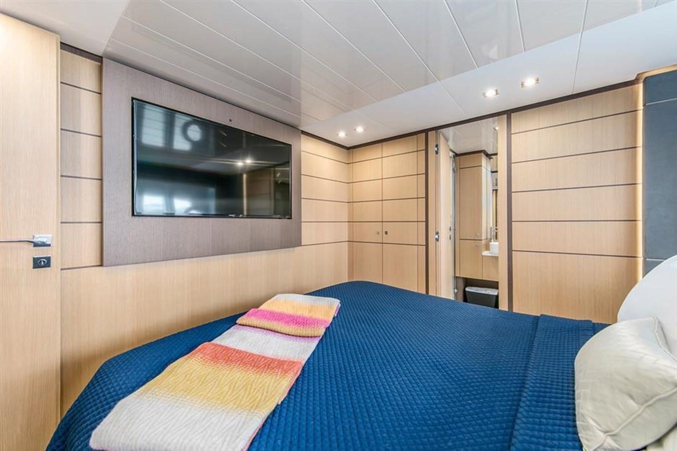 a bed in a room aboard LONTANO Yacht for Sale
