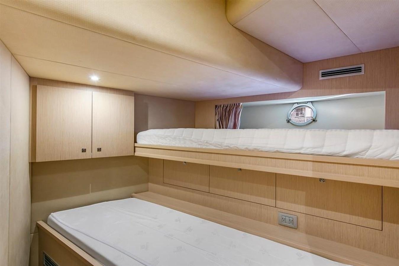a room with wooden cabinets aboard LONTANO Yacht for Sale