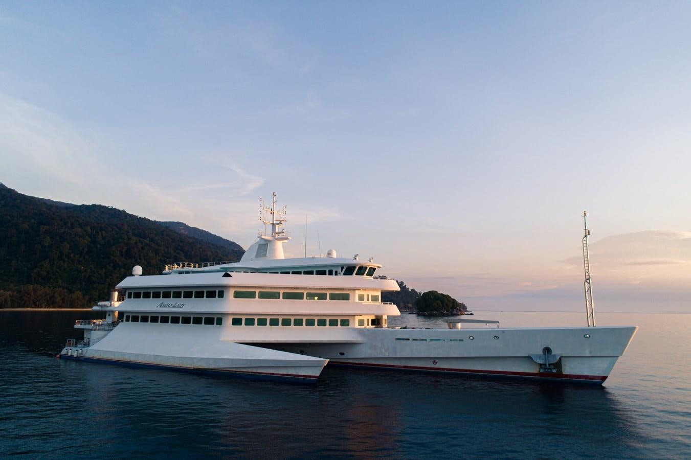 a large white boat in the water aboard ASEAN LADY Yacht for Sale