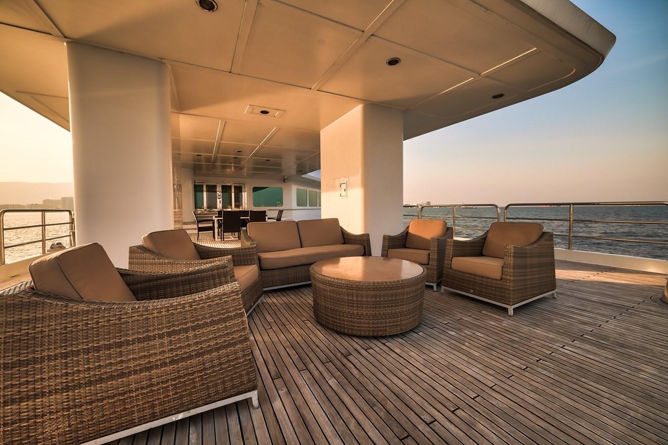 a living room with a large balcony aboard ASEAN LADY Yacht for Sale