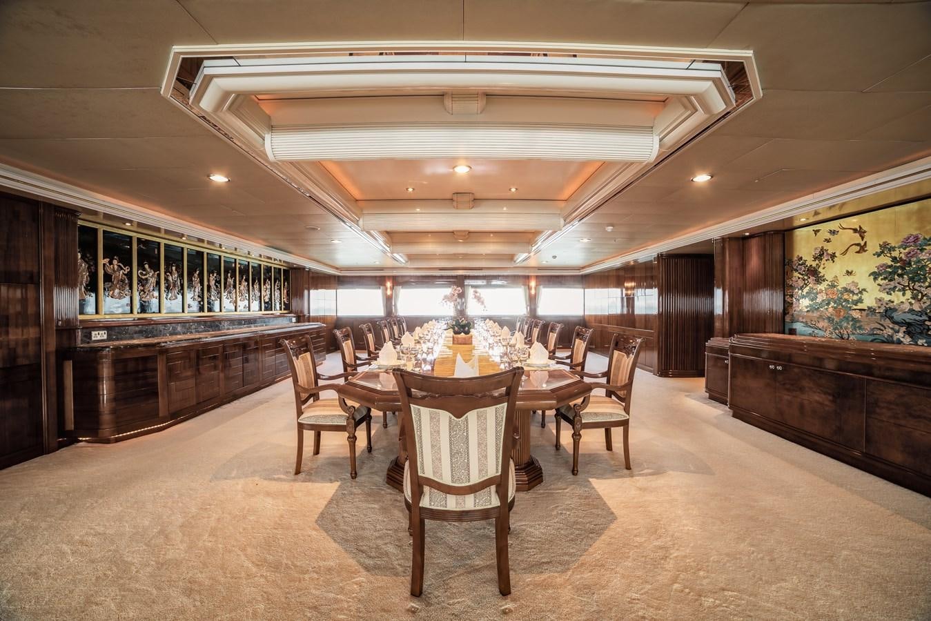 a room with a table and chairs aboard ASEAN LADY Yacht for Sale