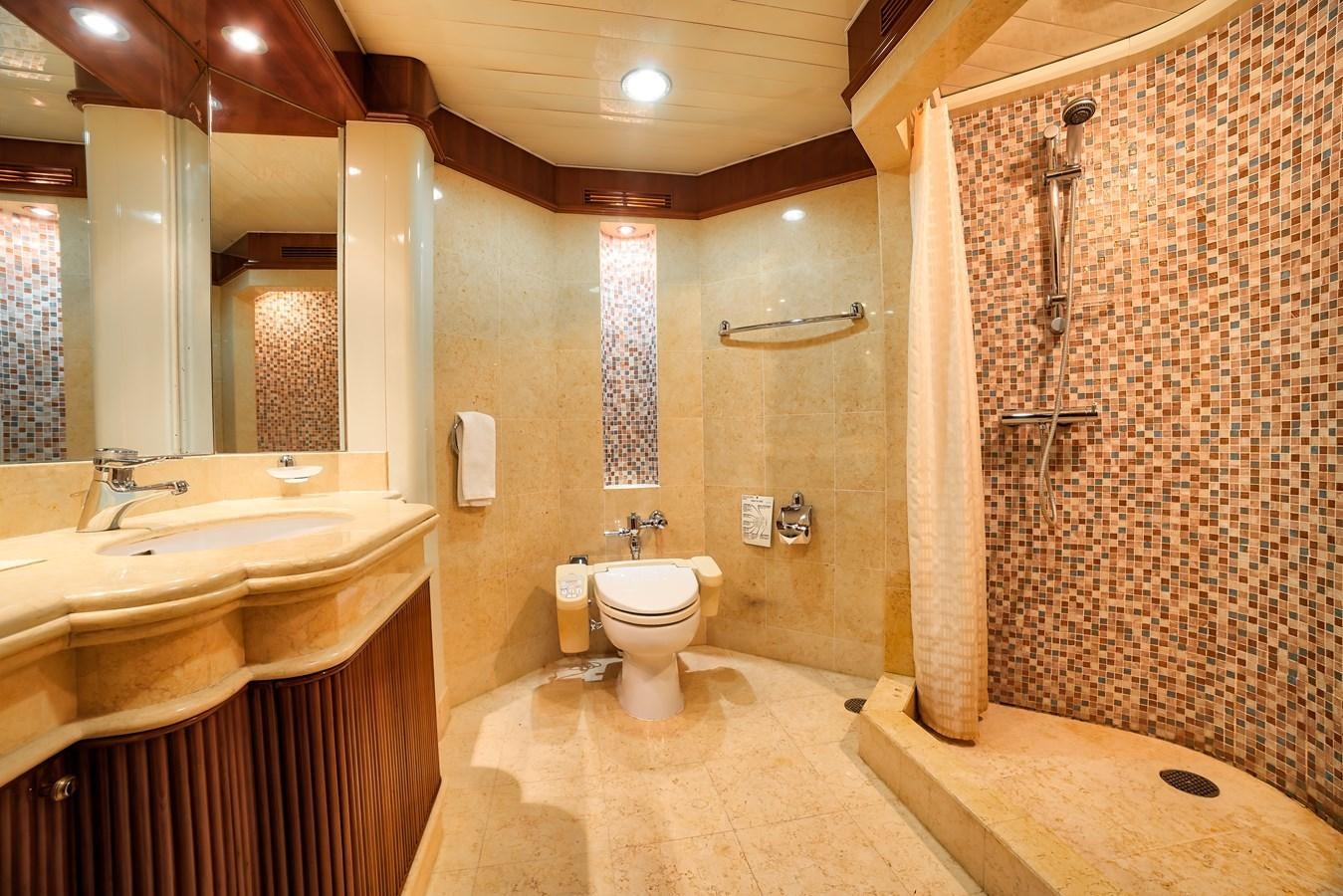 a bathroom with a shower curtain and a sink aboard ASEAN LADY Yacht for Sale
