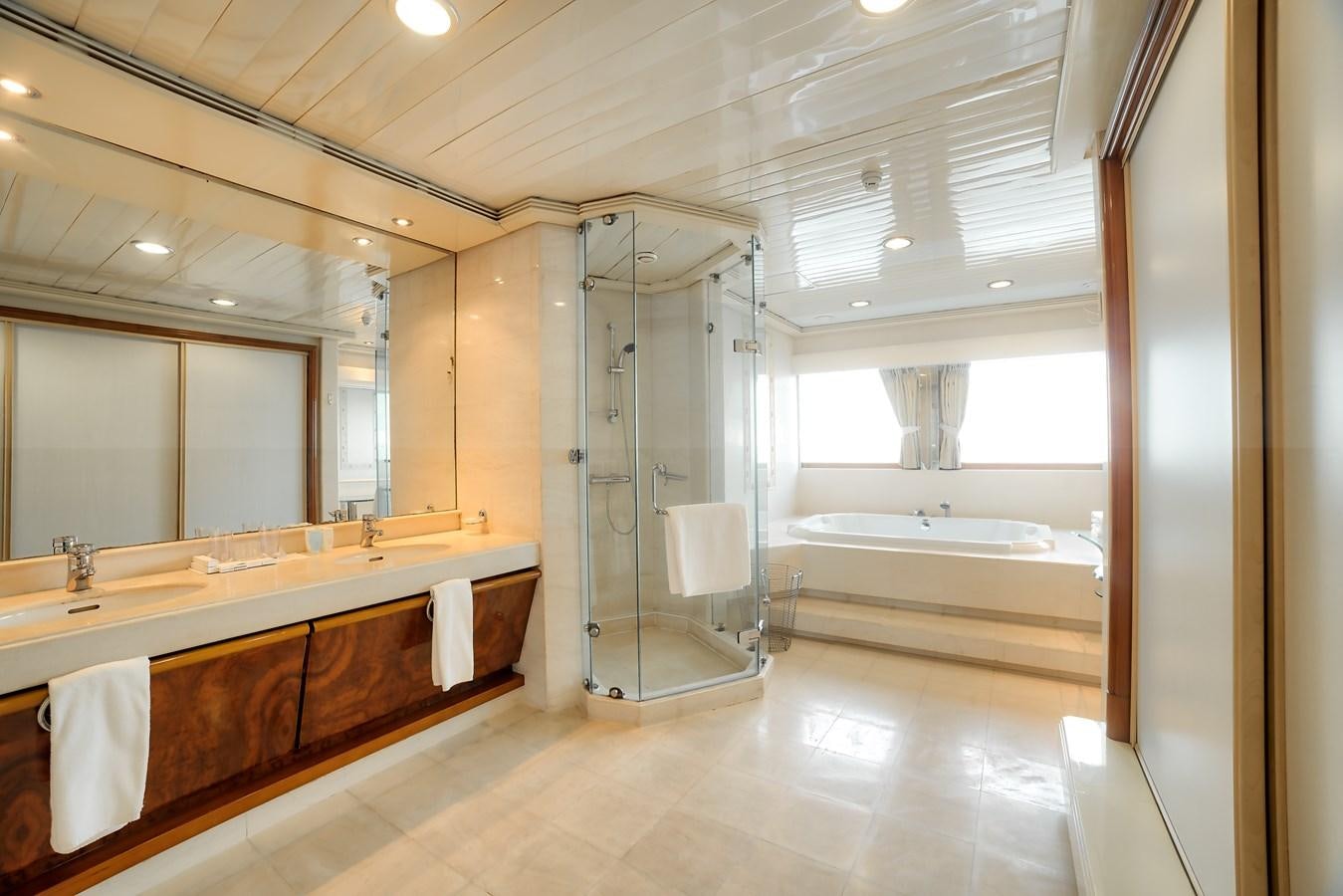 a bathroom with a glass shower aboard ASEAN LADY Yacht for Sale