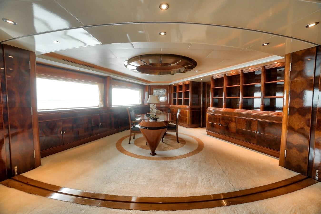 a room with a table and chairs aboard ASEAN LADY Yacht for Sale