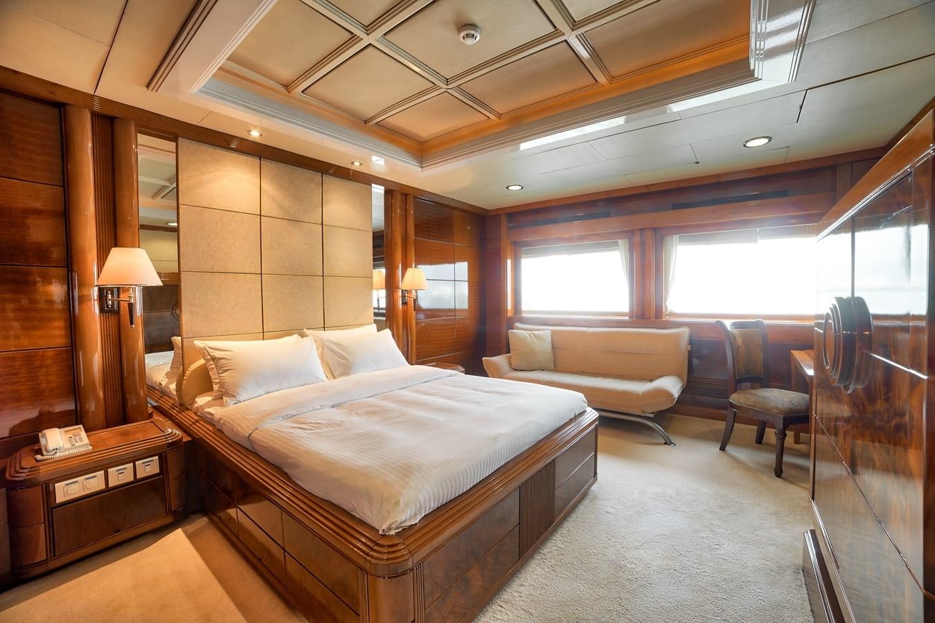 a room with a bed and a couch aboard ASEAN LADY Yacht for Sale