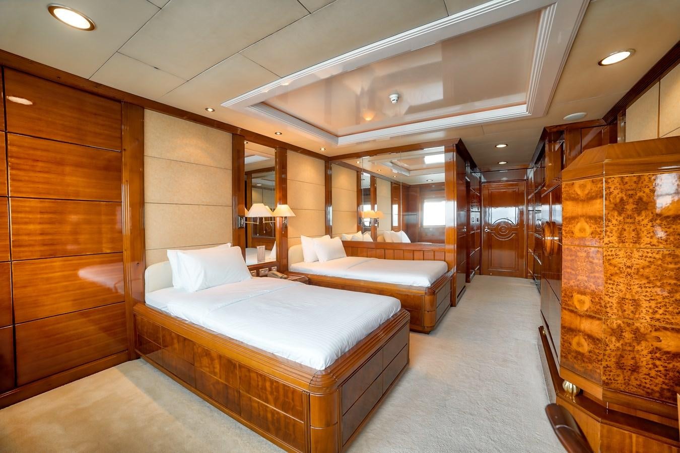 a room with a bed and a mirror aboard ASEAN LADY Yacht for Sale