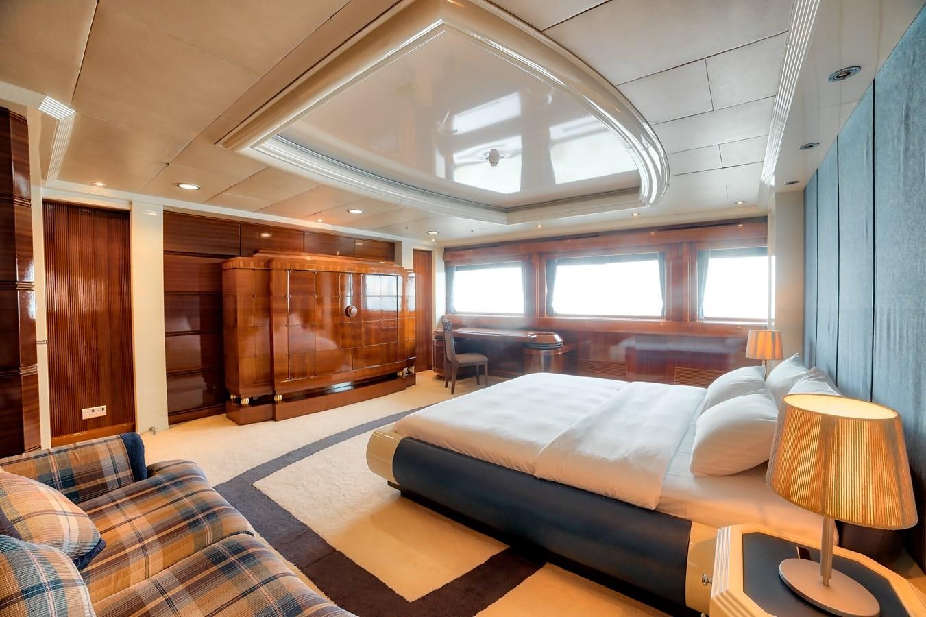 a room with a bed and a window aboard ASEAN LADY Yacht for Sale
