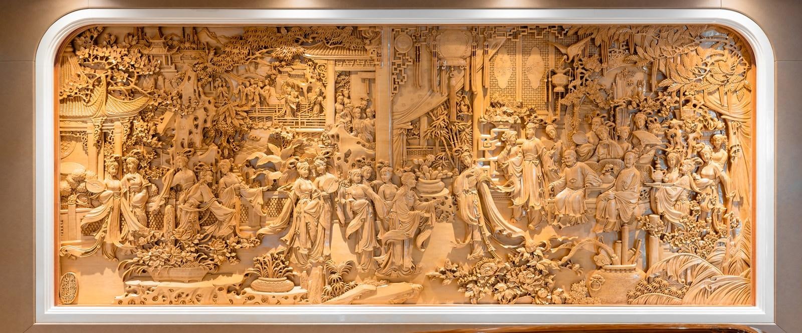 a gold framed picture of a group of people aboard ASEAN LADY Yacht for Sale