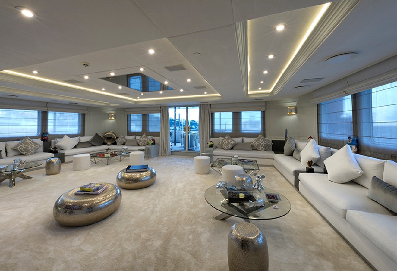 a large living room with a large window aboard CHAKRA Yacht for Charter