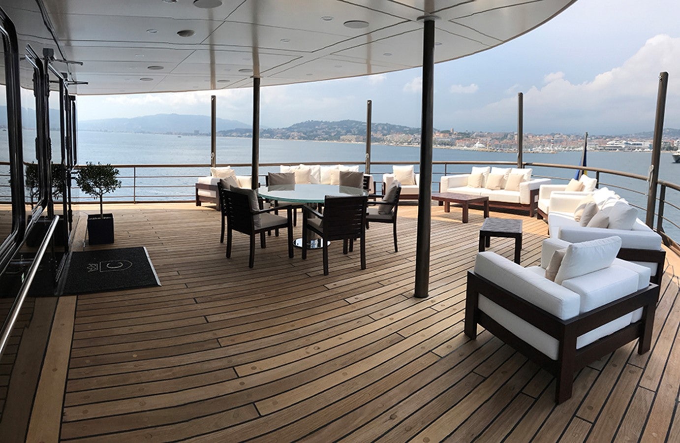 a deck with a view of the ocean and the ocean aboard CHAKRA Yacht for Charter