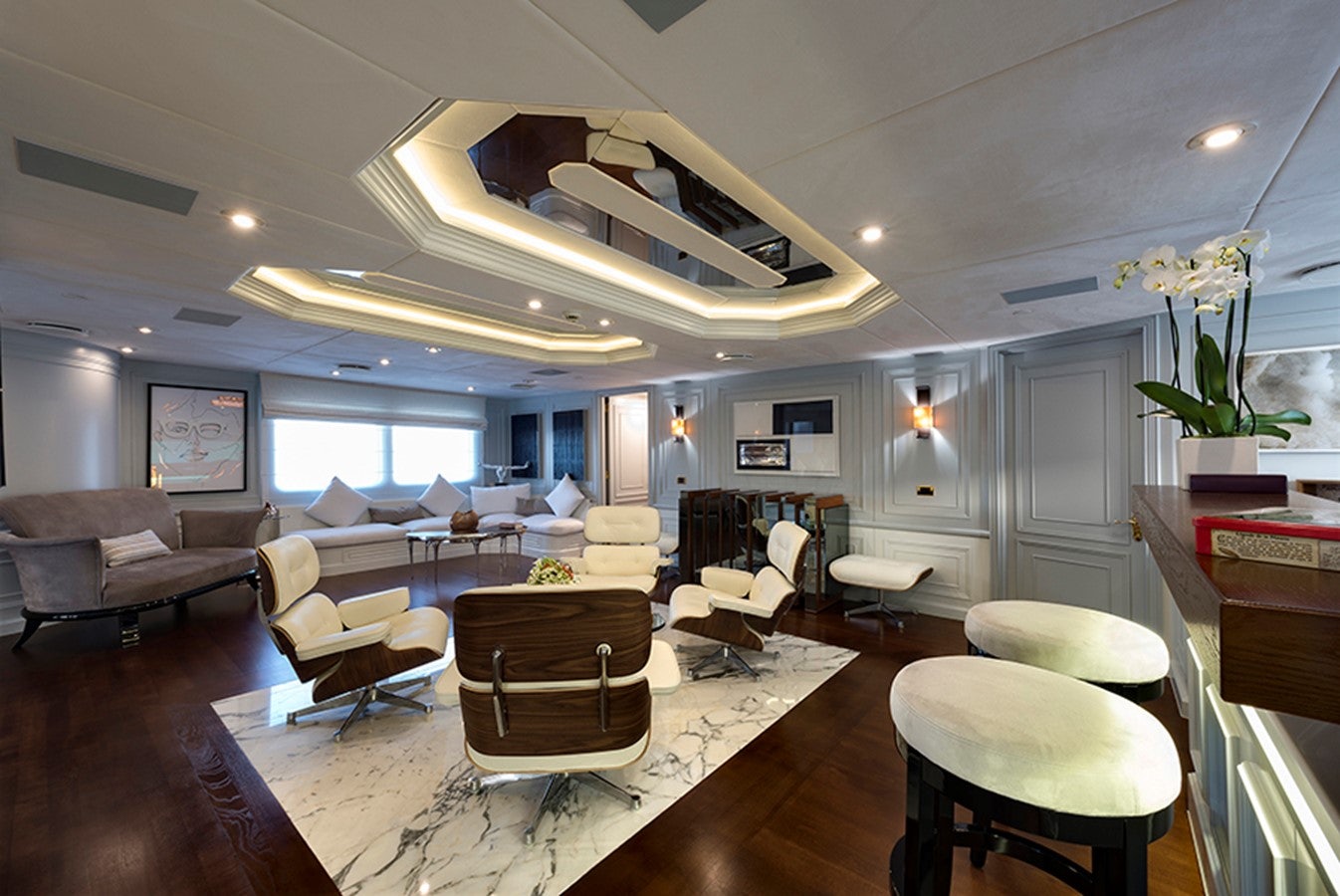 a living room with a ceiling fan aboard CHAKRA Yacht for Charter