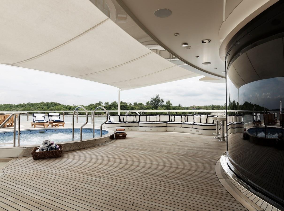 a covered patio with a pool aboard DRAAK Yacht for Sale