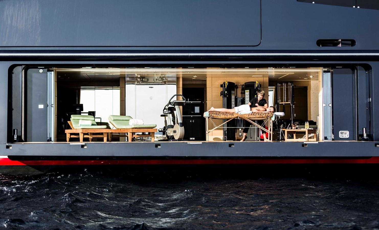 a building with a couple of people sitting at a table aboard DRAAK Yacht for Sale