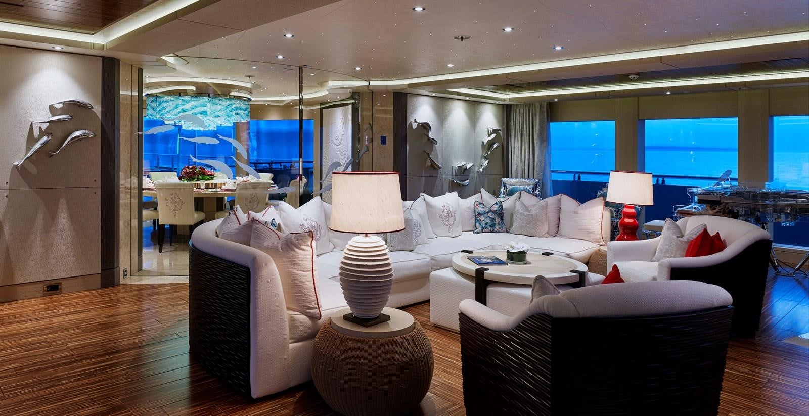 a living room with a large window aboard DRAAK Yacht for Sale