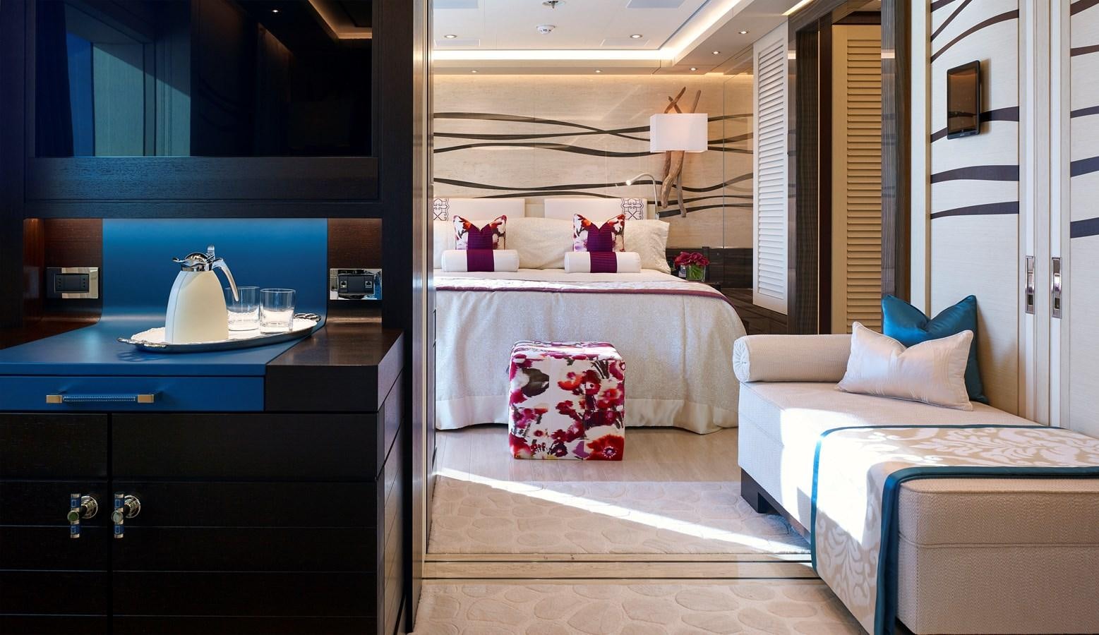 a room with a bed and a desk aboard DRAAK Yacht for Sale