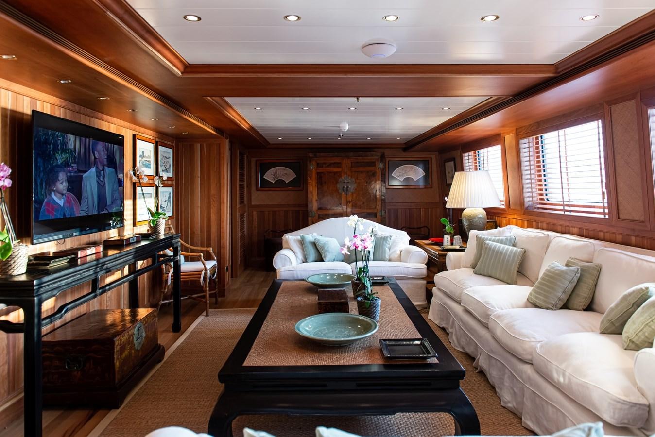 a living room with a large television aboard BLEU DE NIMES Yacht for Sale