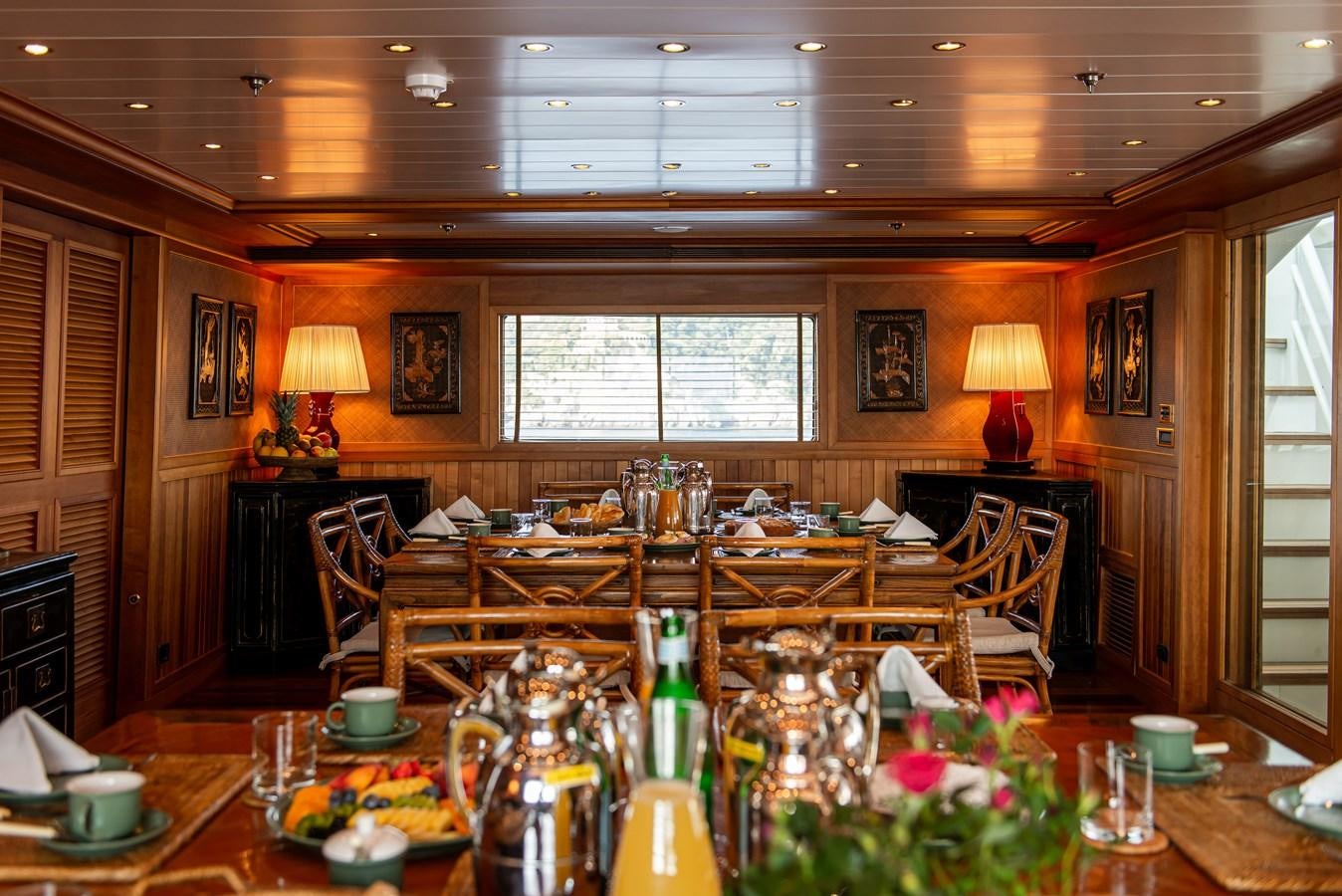a dining room with a table and chairs aboard BLEU DE NIMES Yacht for Sale