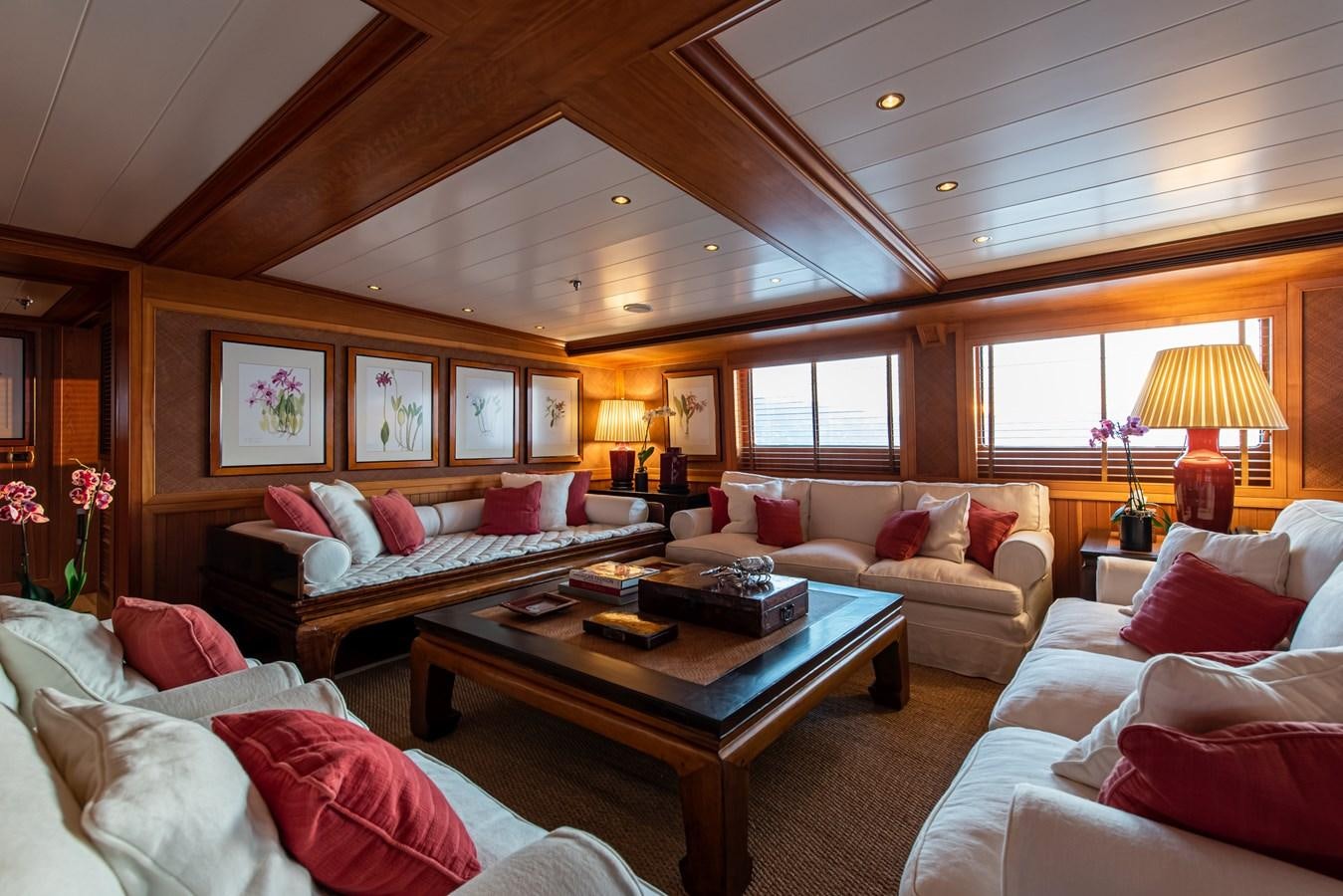 a living room with a couch and a coffee table aboard BLEU DE NIMES Yacht for Sale