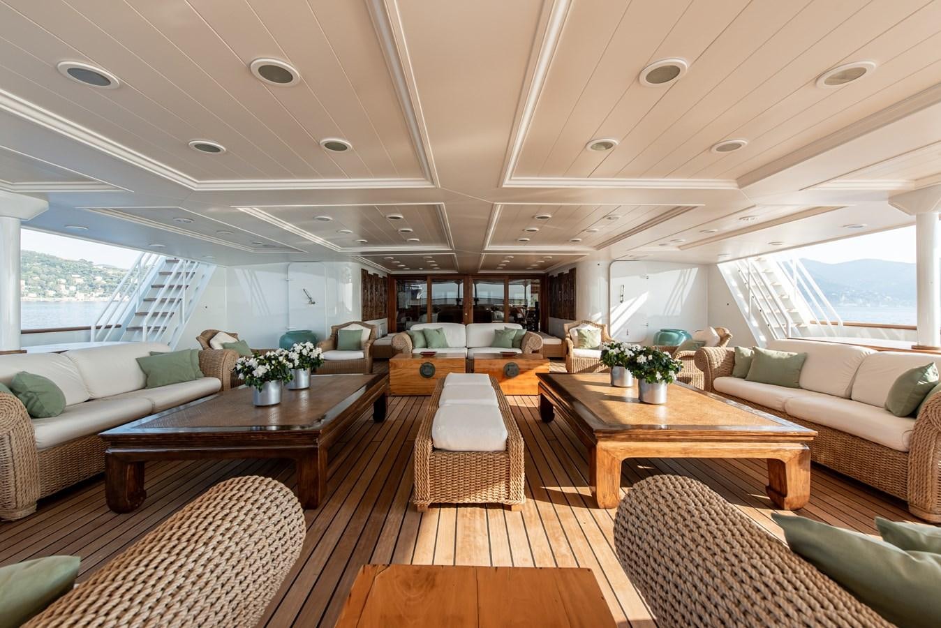a living room with a large window aboard BLEU DE NIMES Yacht for Charter