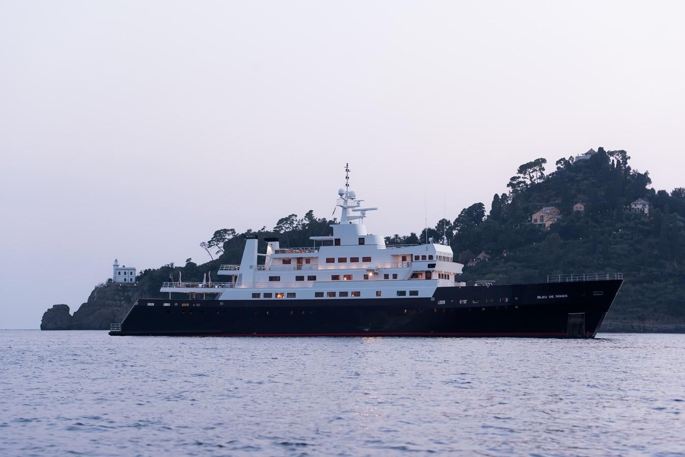 a large boat on the water aboard BLEU DE NIMES Yacht for Charter