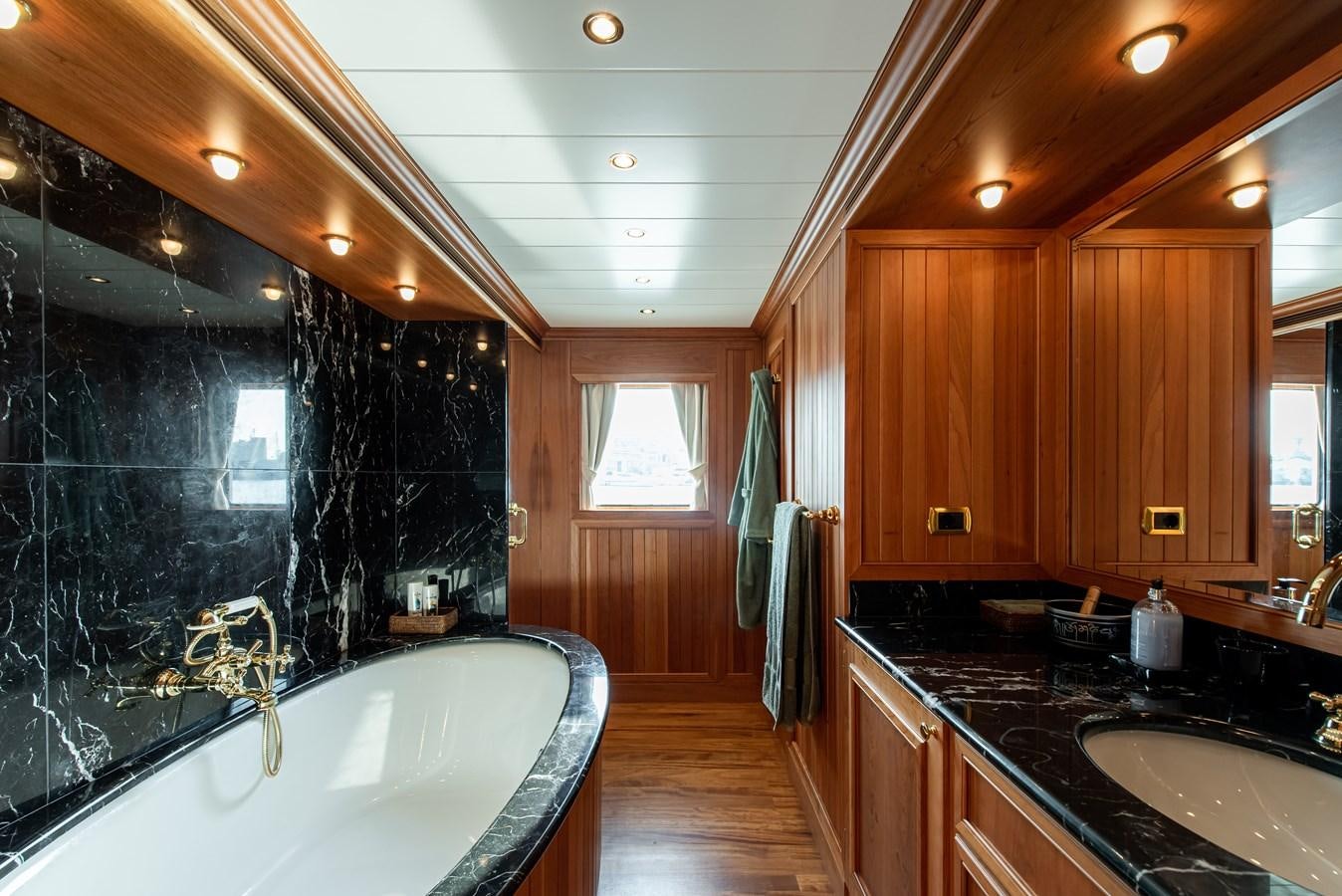 a bathroom with a large bathtub aboard BLEU DE NIMES Yacht for Sale
