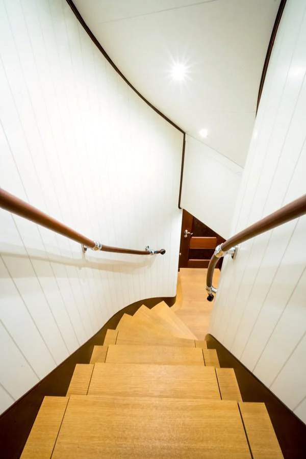 a hallway with a wood floor and a door aboard MIKHAIL S. VORONTSOV Yacht for Sale