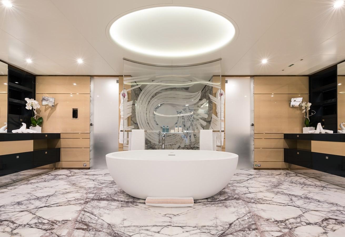 a large white bathtub in a bathroom aboard ALMAX Yacht for Charter
