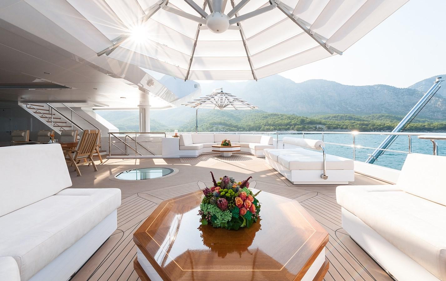 a room with a table and chairs aboard ALMAX Yacht for Charter