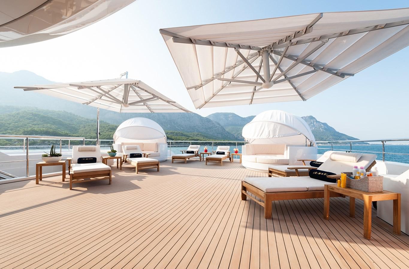 a room with tables and chairs aboard ALMAX Yacht for Charter