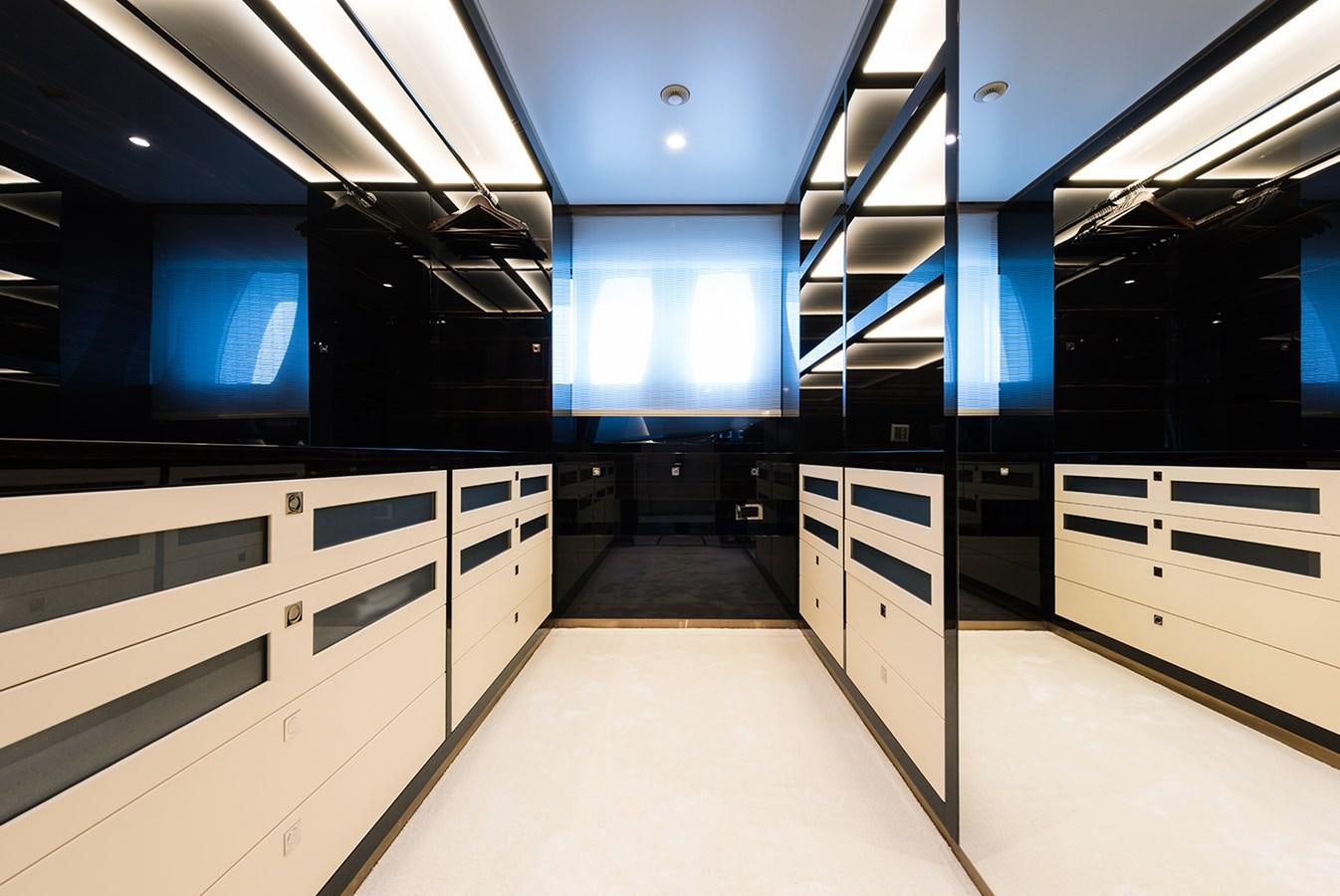 a room with white cabinets and black cabinets aboard ALMAX Yacht for Charter