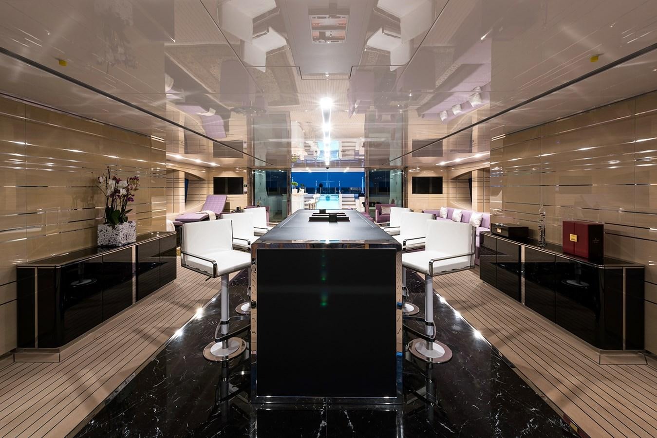 a room with a large table and chairs aboard ALMAX Yacht for Charter