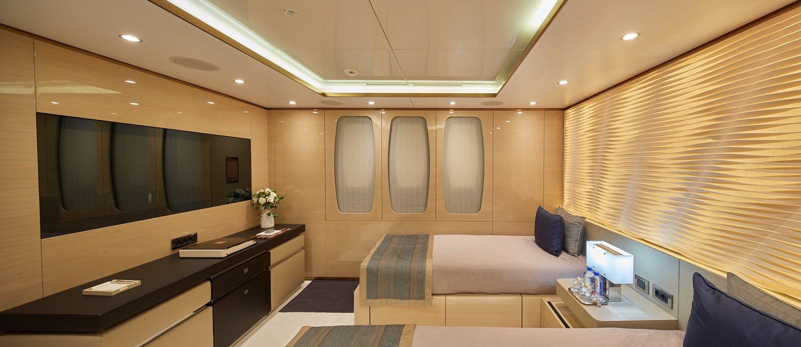 a room with a desk and a bed aboard ALMAX Yacht for Charter