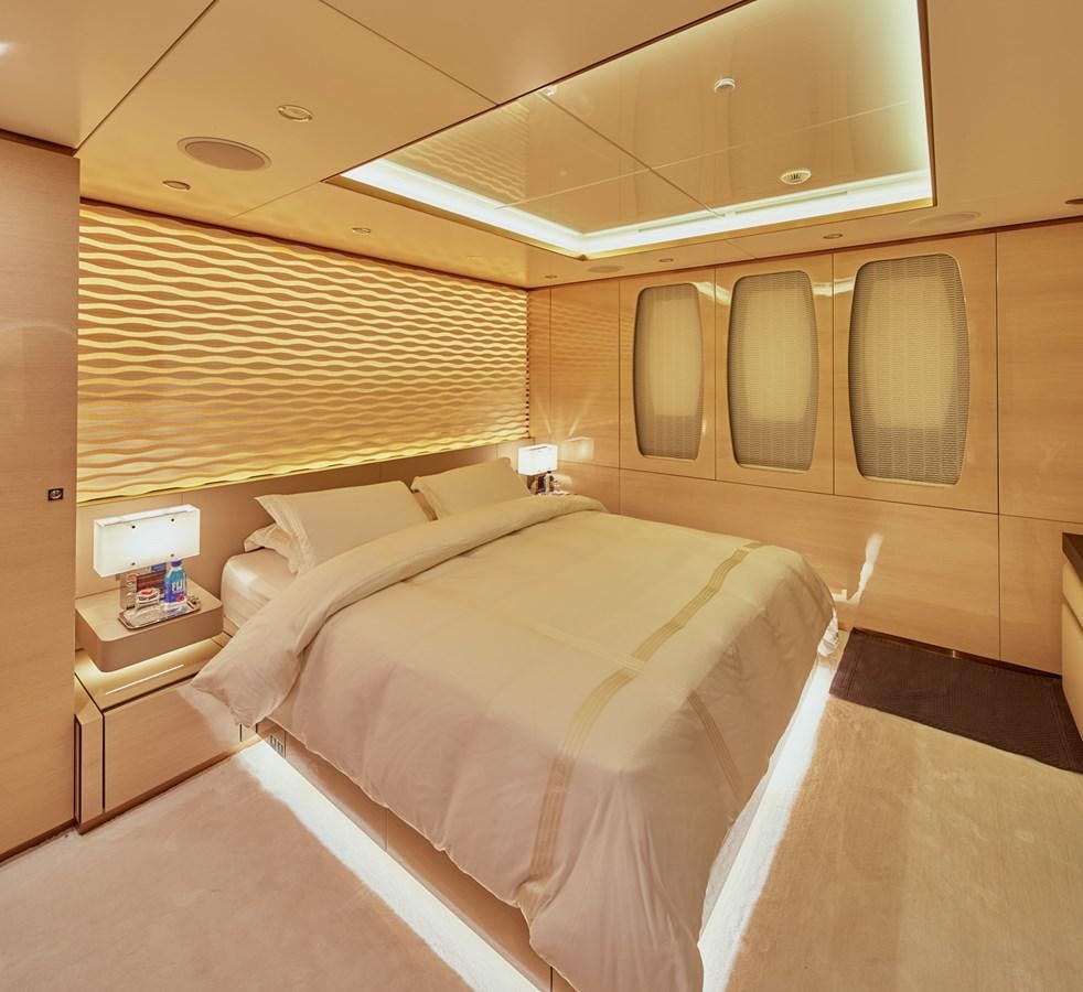 a room with a bed and a wooden wall aboard ALMAX Yacht for Charter