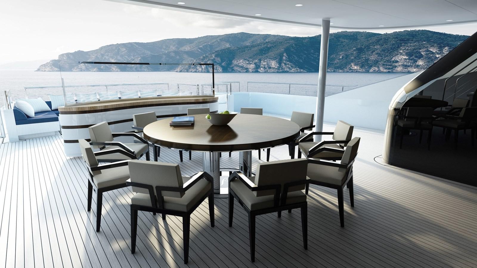 a table and chairs on a deck overlooking a body of water aboard STARLUST Yacht for Sale