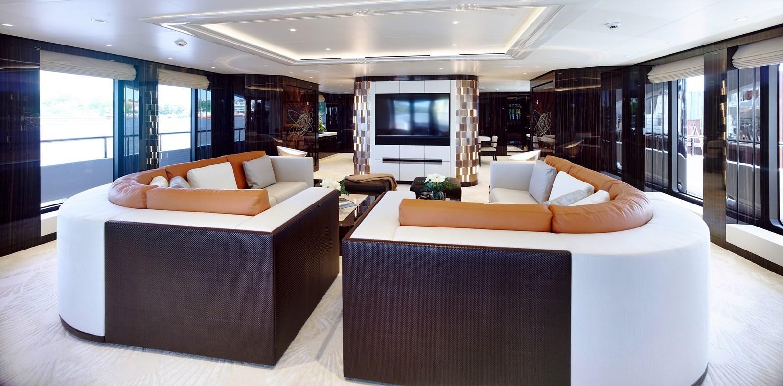 a room with a bed and a couch aboard STARLUST Yacht for Sale