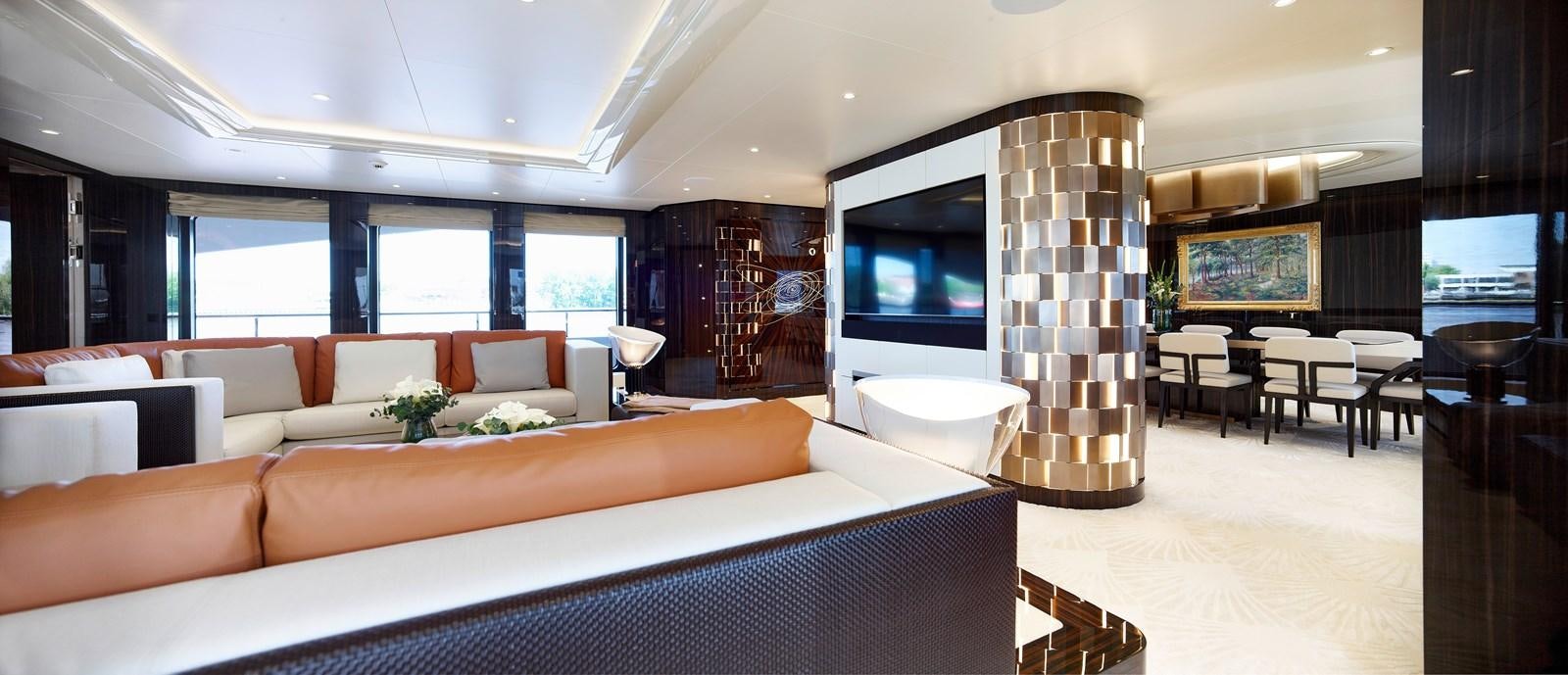 a room with a couch and a tv aboard STARLUST Yacht for Sale