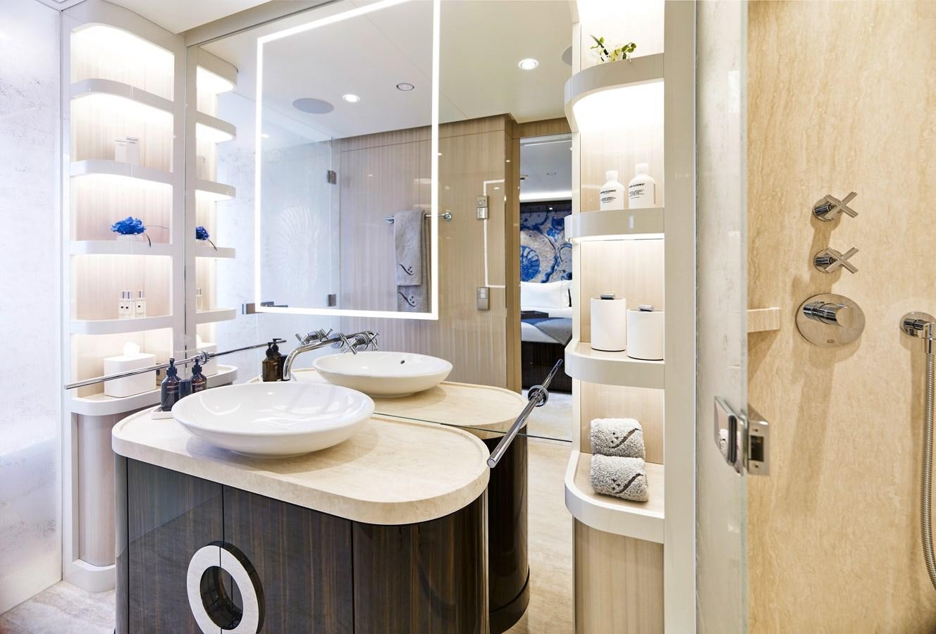 a bathroom with two sinks and a mirror aboard STARLUST Yacht for Sale