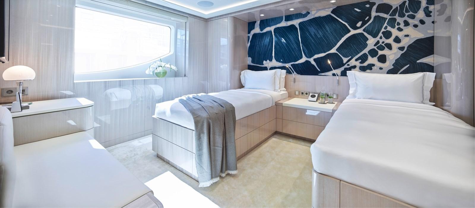 a room with two beds aboard STARLUST Yacht for Sale