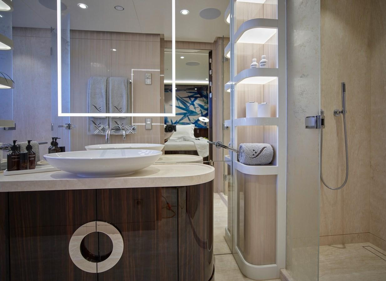 a bathroom with a sink and mirror aboard STARLUST Yacht for Sale