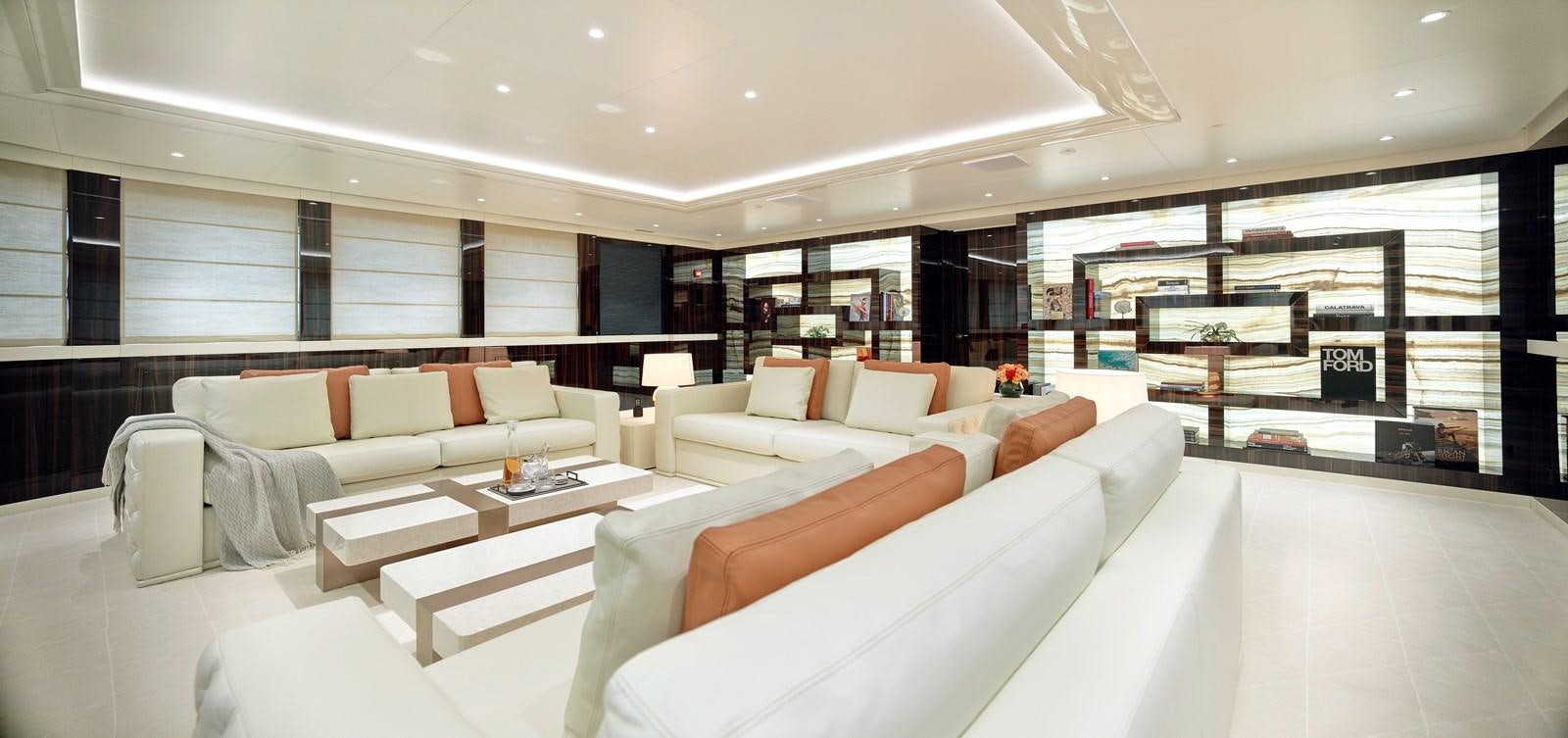 a room with couches and a table aboard STARLUST Yacht for Sale
