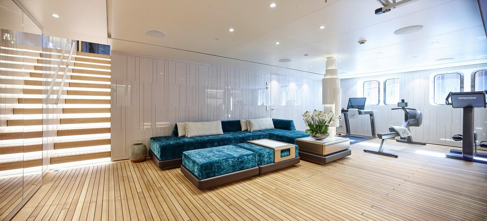 a large living room with a large wood floor aboard STARLUST Yacht for Sale