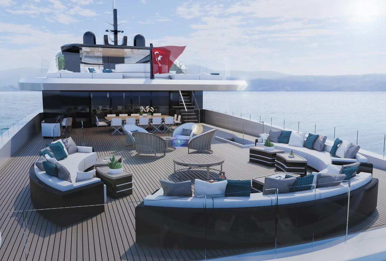 a deck with a large boat and a table on it aboard RMK 65M Yacht for Sale
