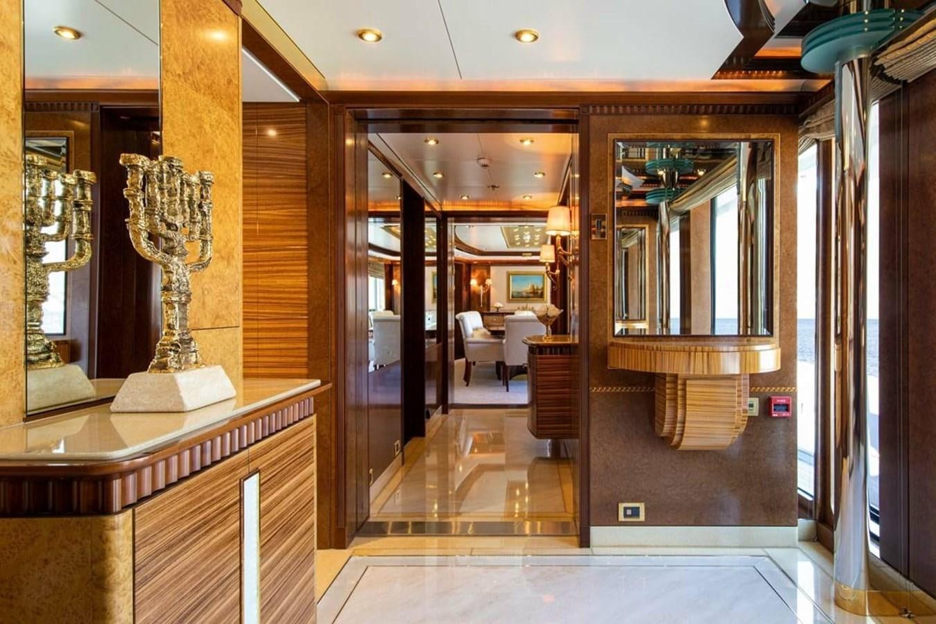 a large room with a glass door aboard LADY MAJA I Yacht for Sale