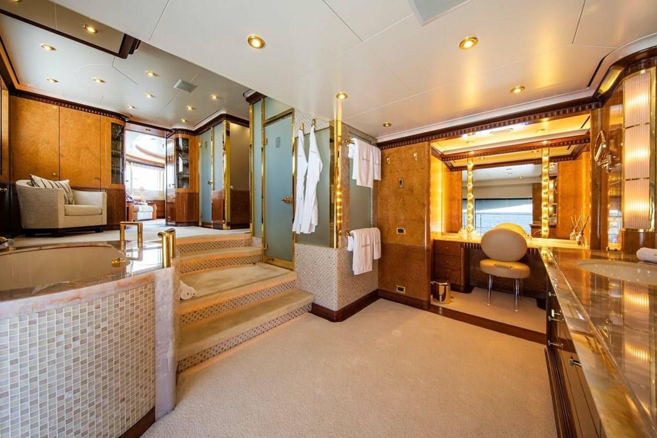 a room with a bed and a chair aboard LADY MAJA I Yacht for Sale
