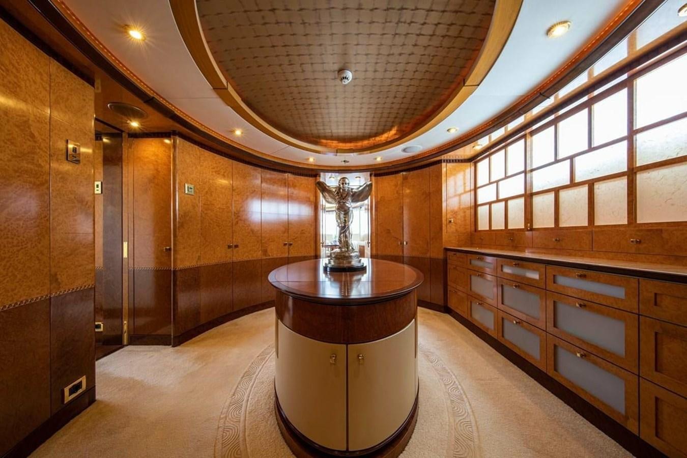 a large room with a large glass table and a large mirror aboard LADY MAJA I Yacht for Sale