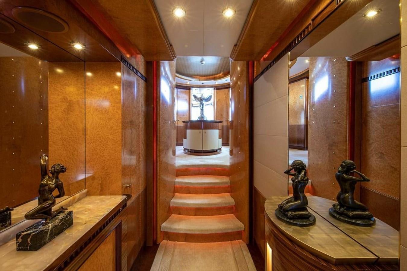 a room with statues and a staircase aboard LADY MAJA I Yacht for Sale