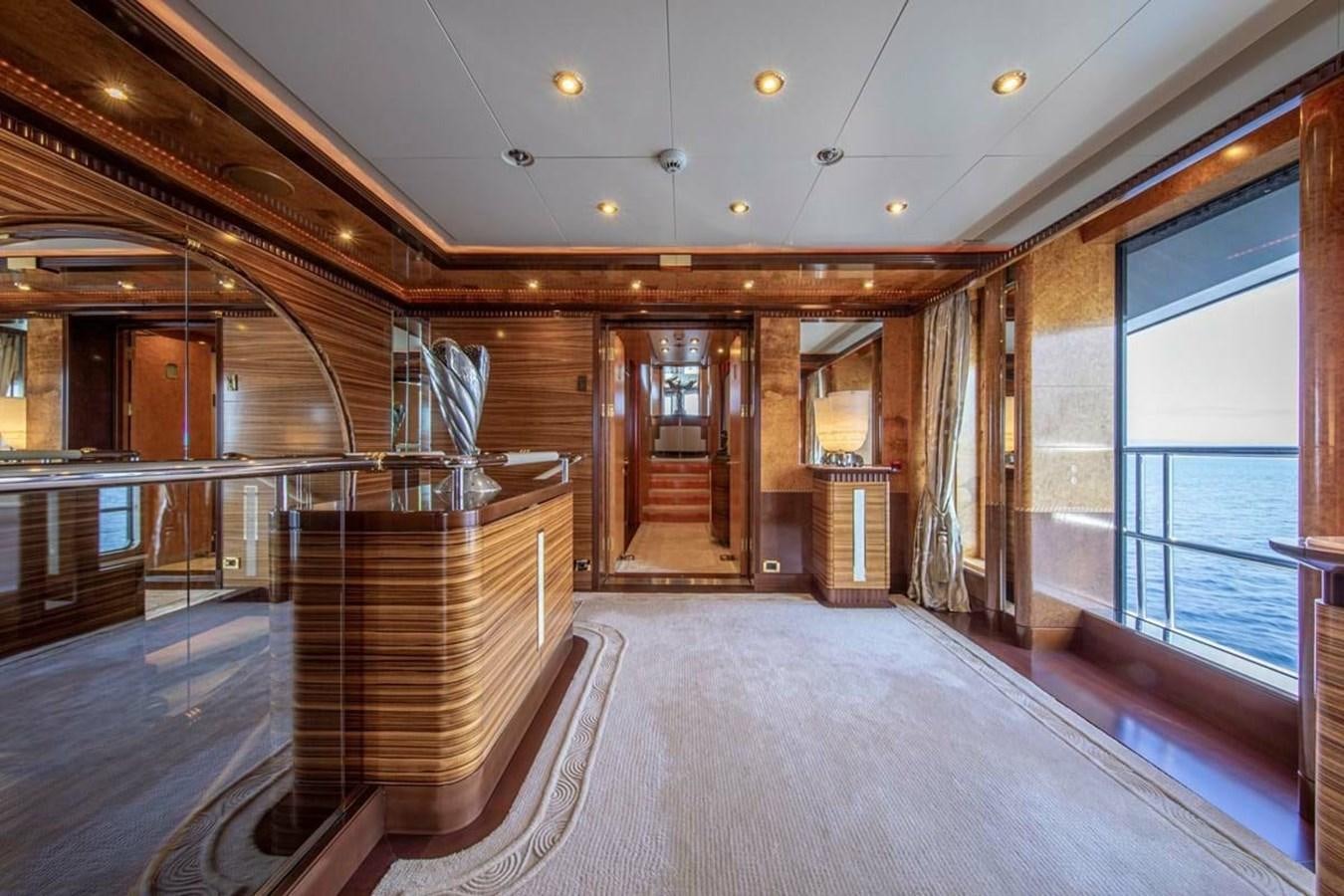 a large room with wood floors aboard LADY MAJA I Yacht for Sale