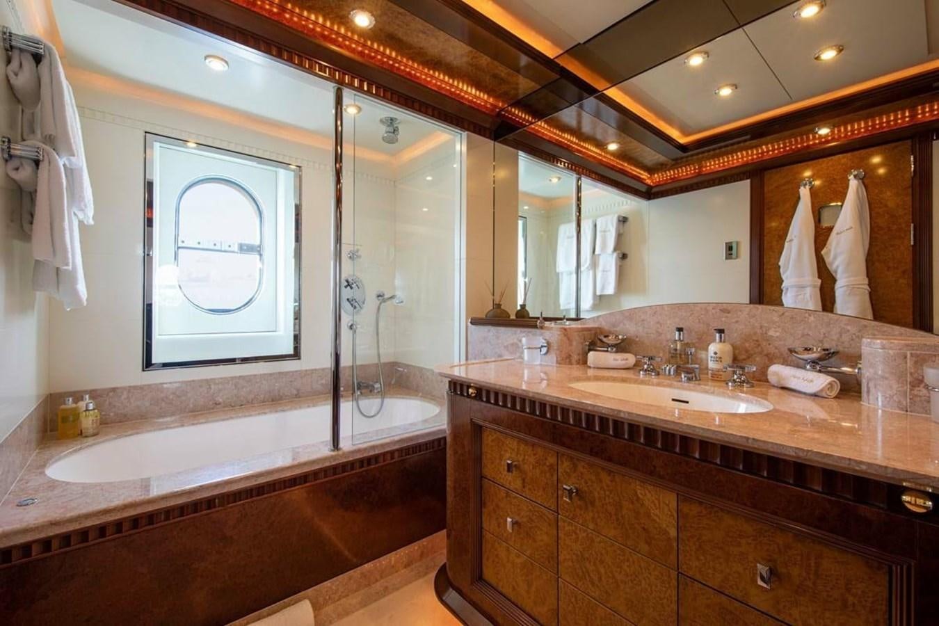 a bathroom with a large mirror aboard LADY MAJA I Yacht for Sale