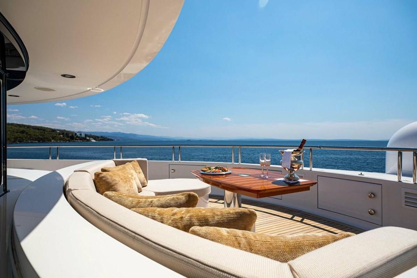 a room with a table and chairs aboard LADY MAJA I Yacht for Sale